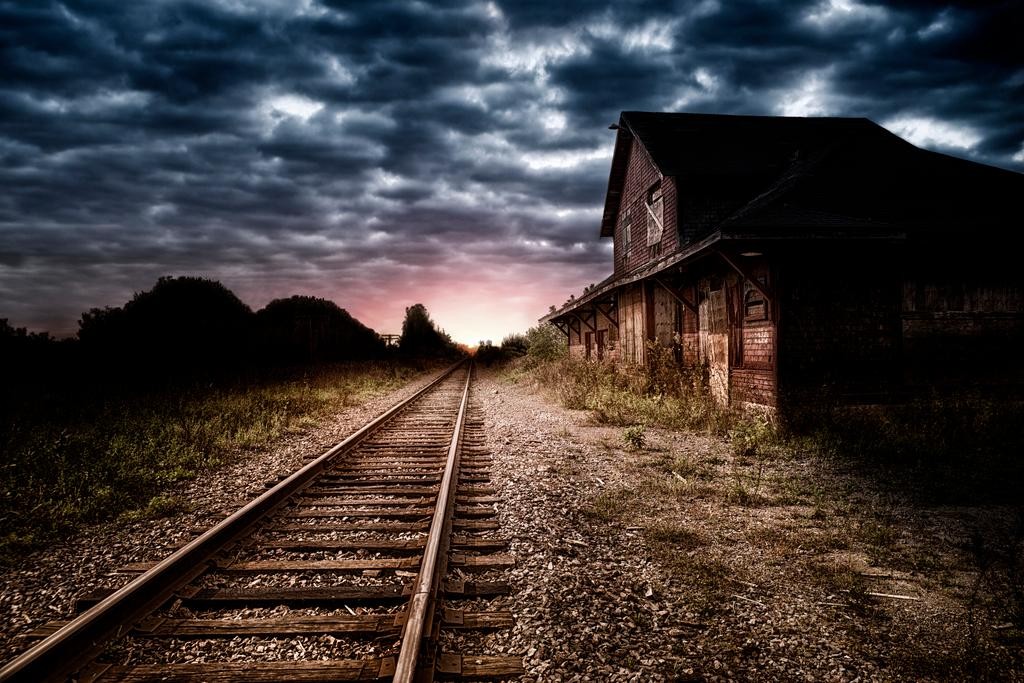 Empty and abandoned train station at night Poster